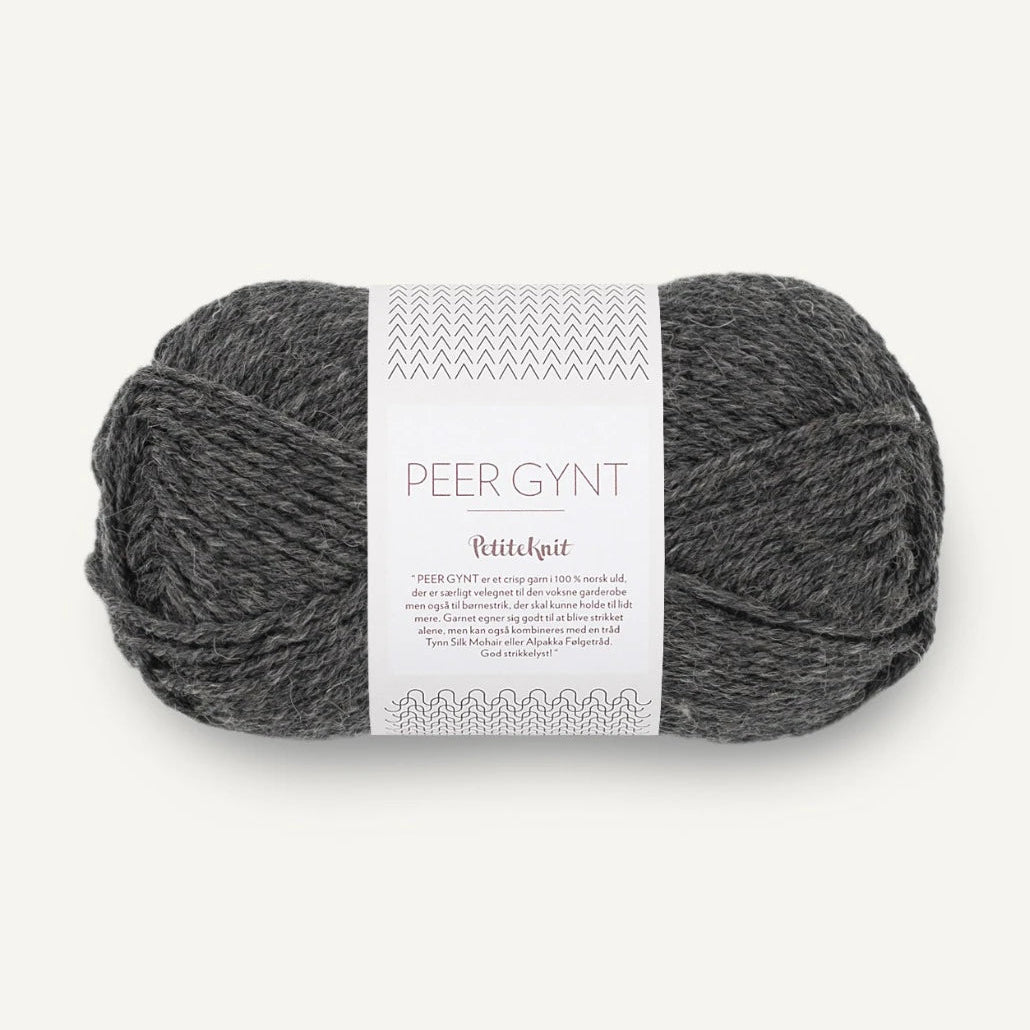 Ball of yarn with a label on a white background