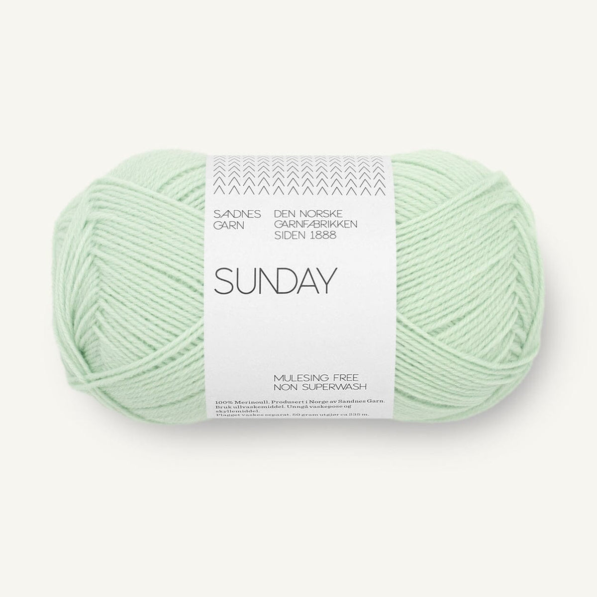 Light green skein of yarn with a label on a white background