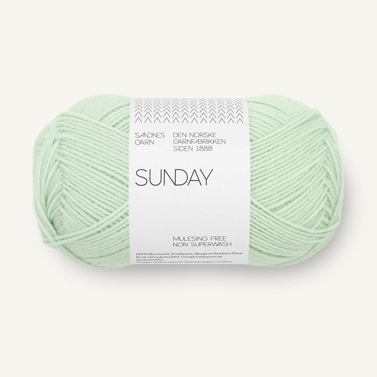 Light green skein of yarn with a label on a white background