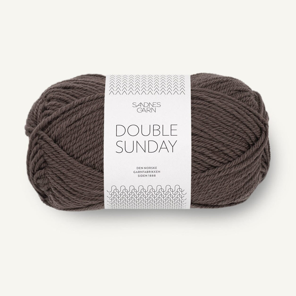 Ball of brown yarn with a label on a white background