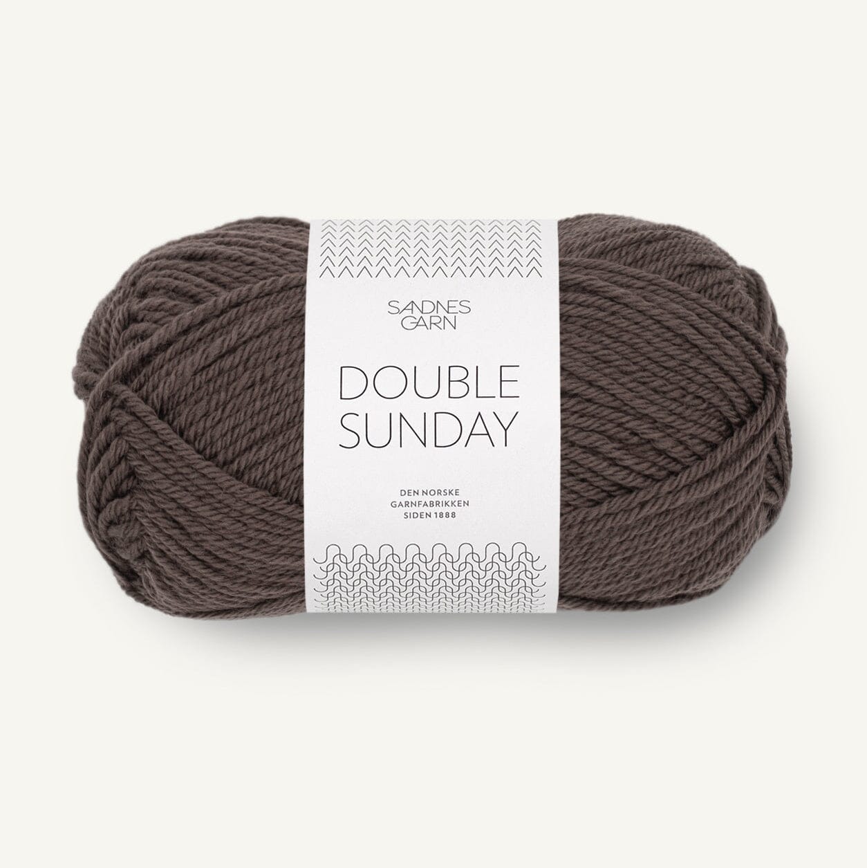 Ball of brown yarn with a label on a white background