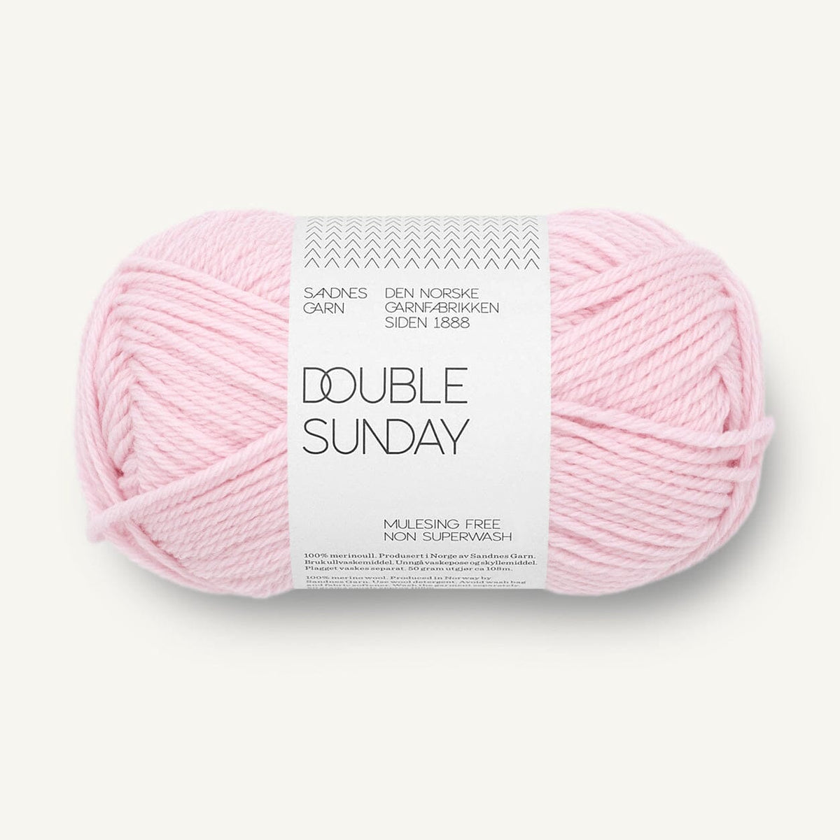 A single ball of light pink yarn with a white paper label reading 'DOUBLE SUNDAY' and 'Sundnes Garn', photographed on a clean off-white background.