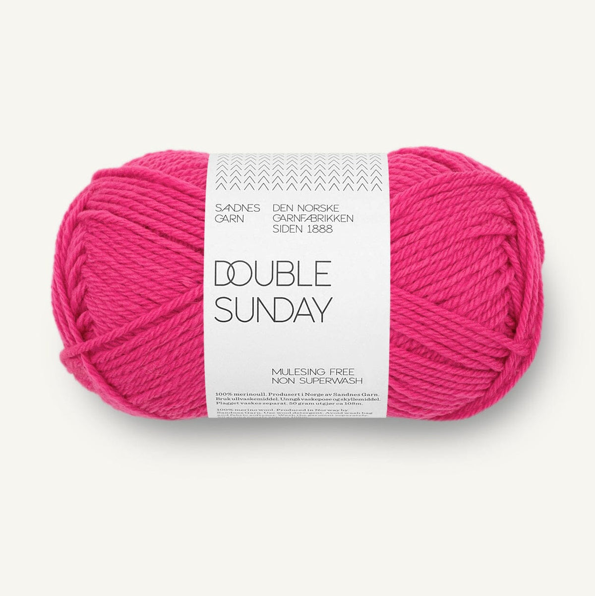 A skein of bright pink yarn with a white paper label reading 'DOUBLE SUNDAY' and 'SANDNES GARN', photographed on a clean off-white background.
