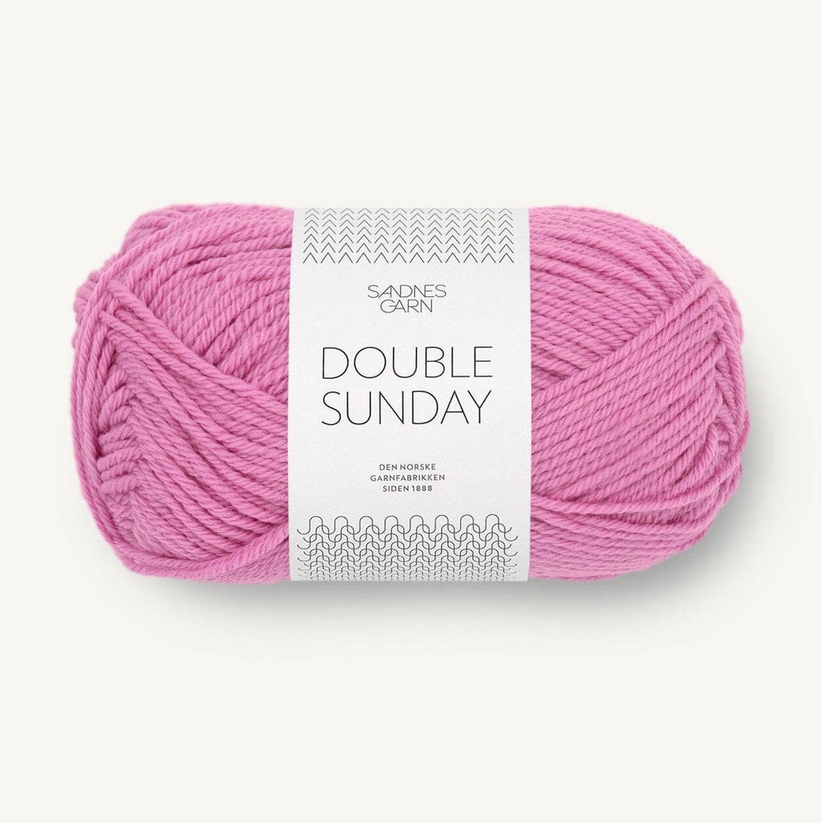 Pink skein of yarn with a label on a white background