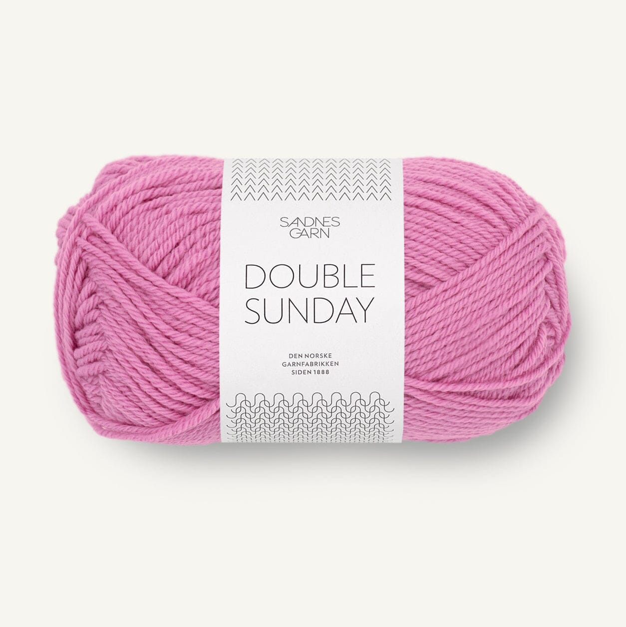 Pink skein of yarn with a label on a white background