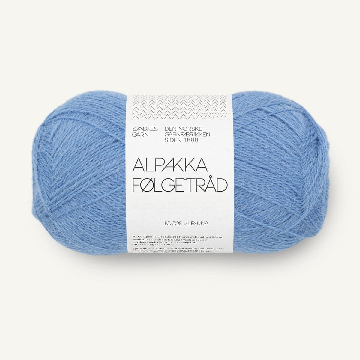 Blue yarn ball with a label on a white background