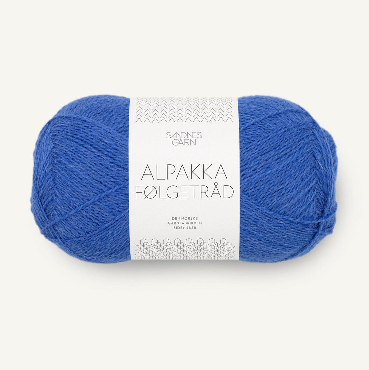 Blue ball of yarn with a label on a white background