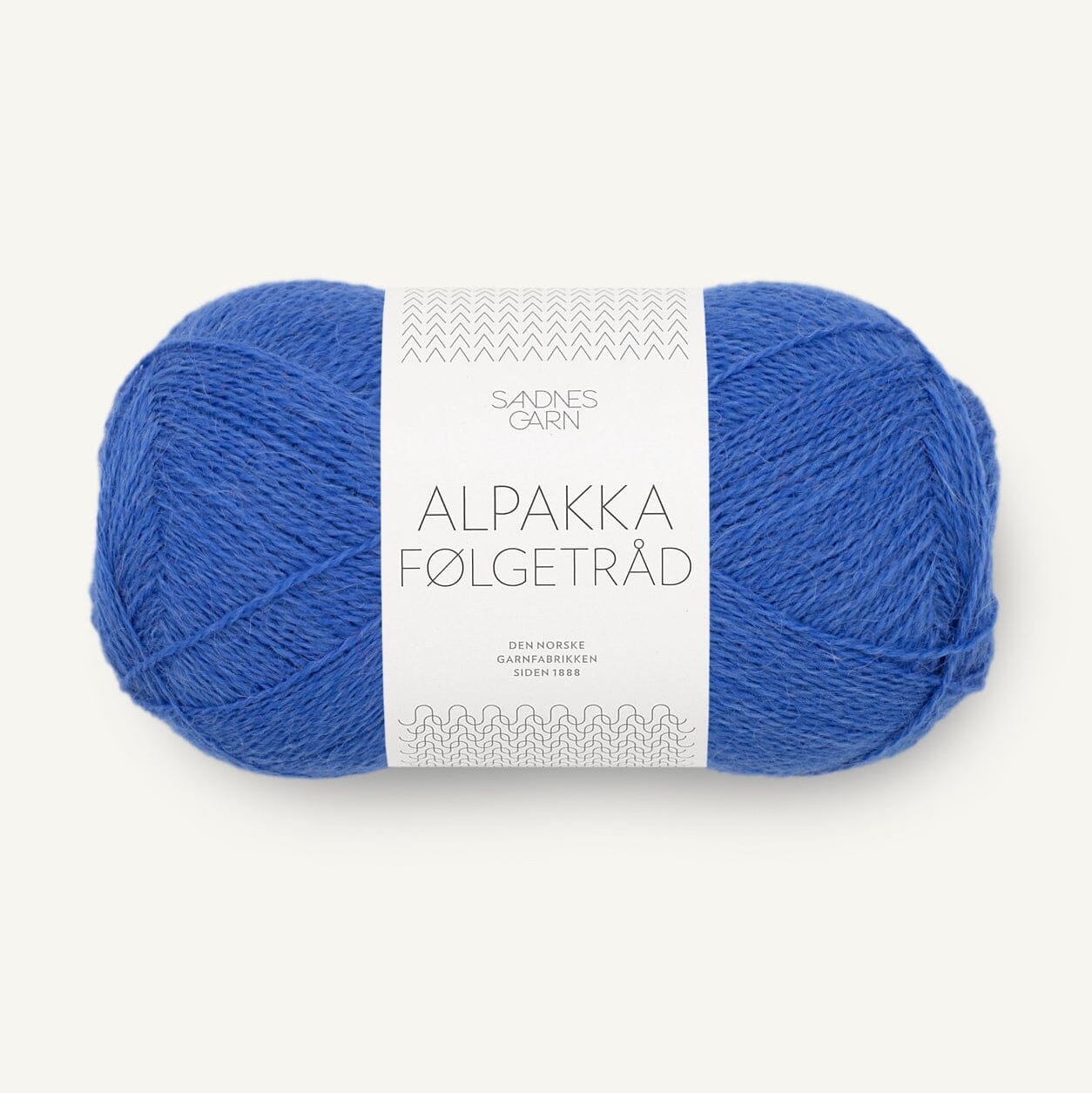 Blue ball of yarn with a label on a white background
