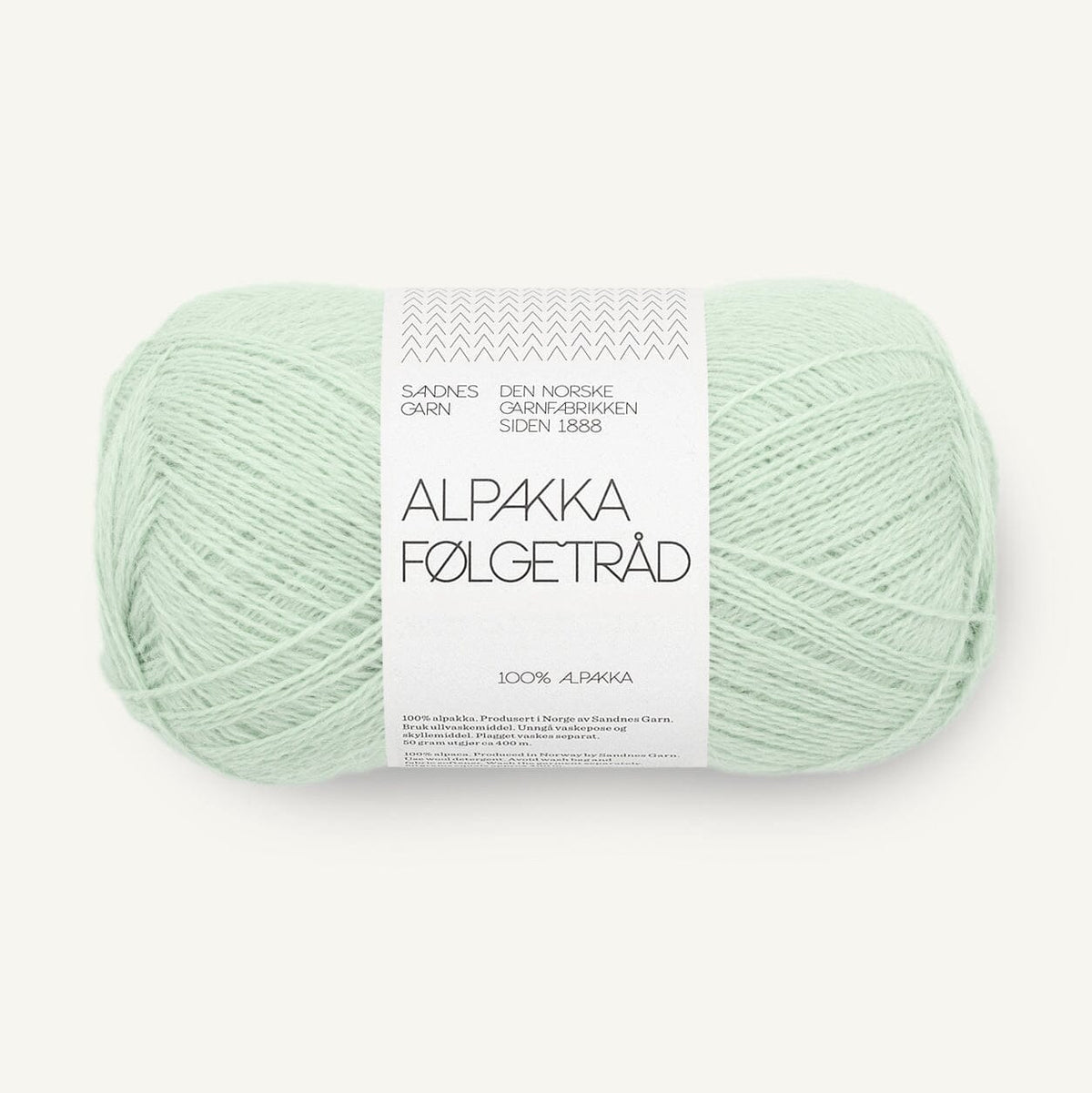 Light green skein of yarn with a label on a white background