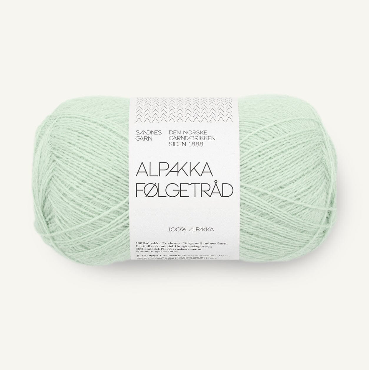 Light green skein of yarn with a label on a white background