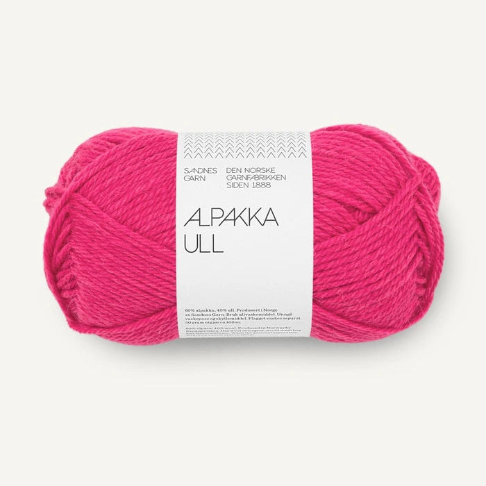 A skein of bright pink Alpaca Ull yarn with a white paper label, centered on a light off-white background.