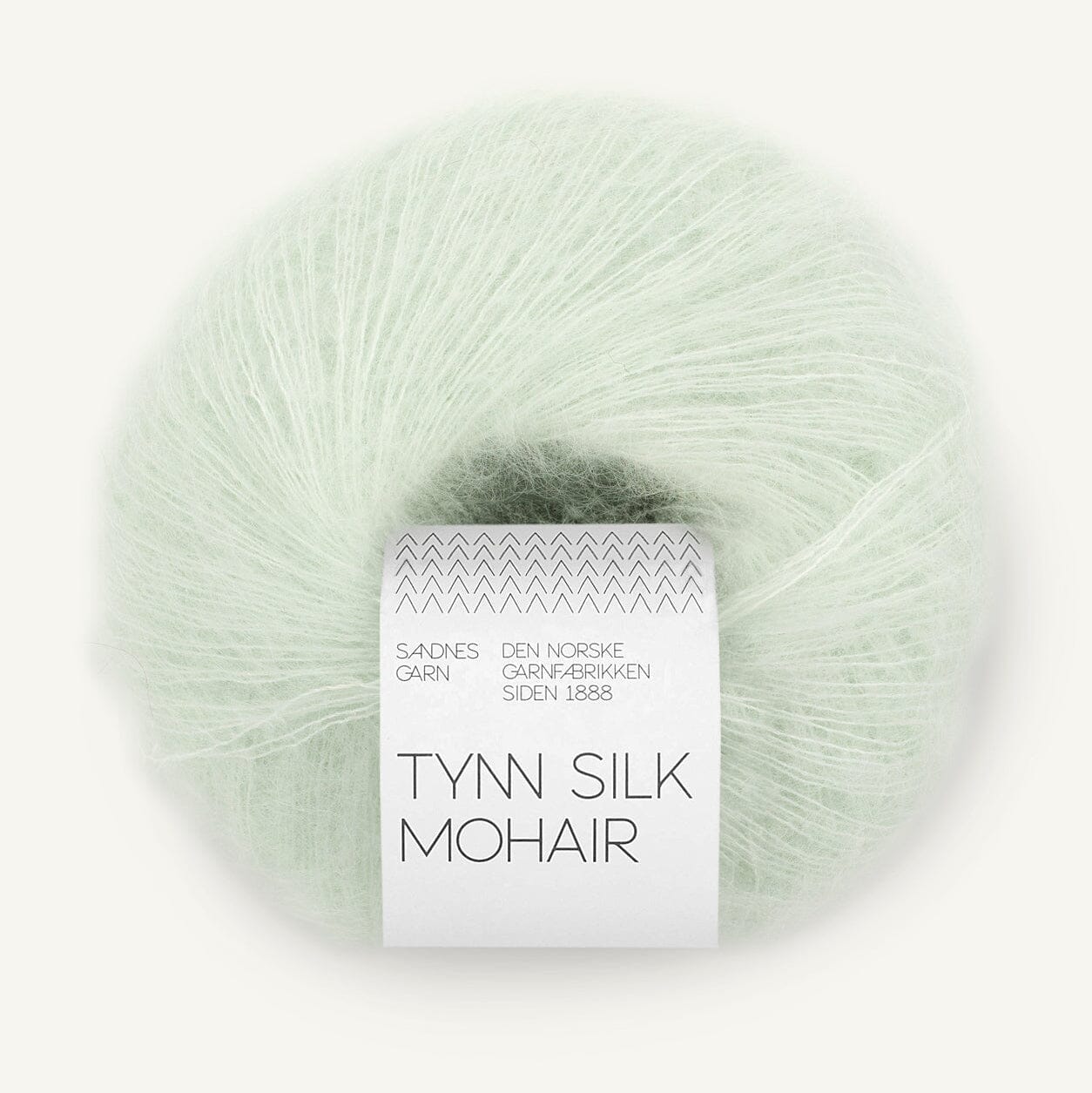 Ball of light green yarn with a label on a white background