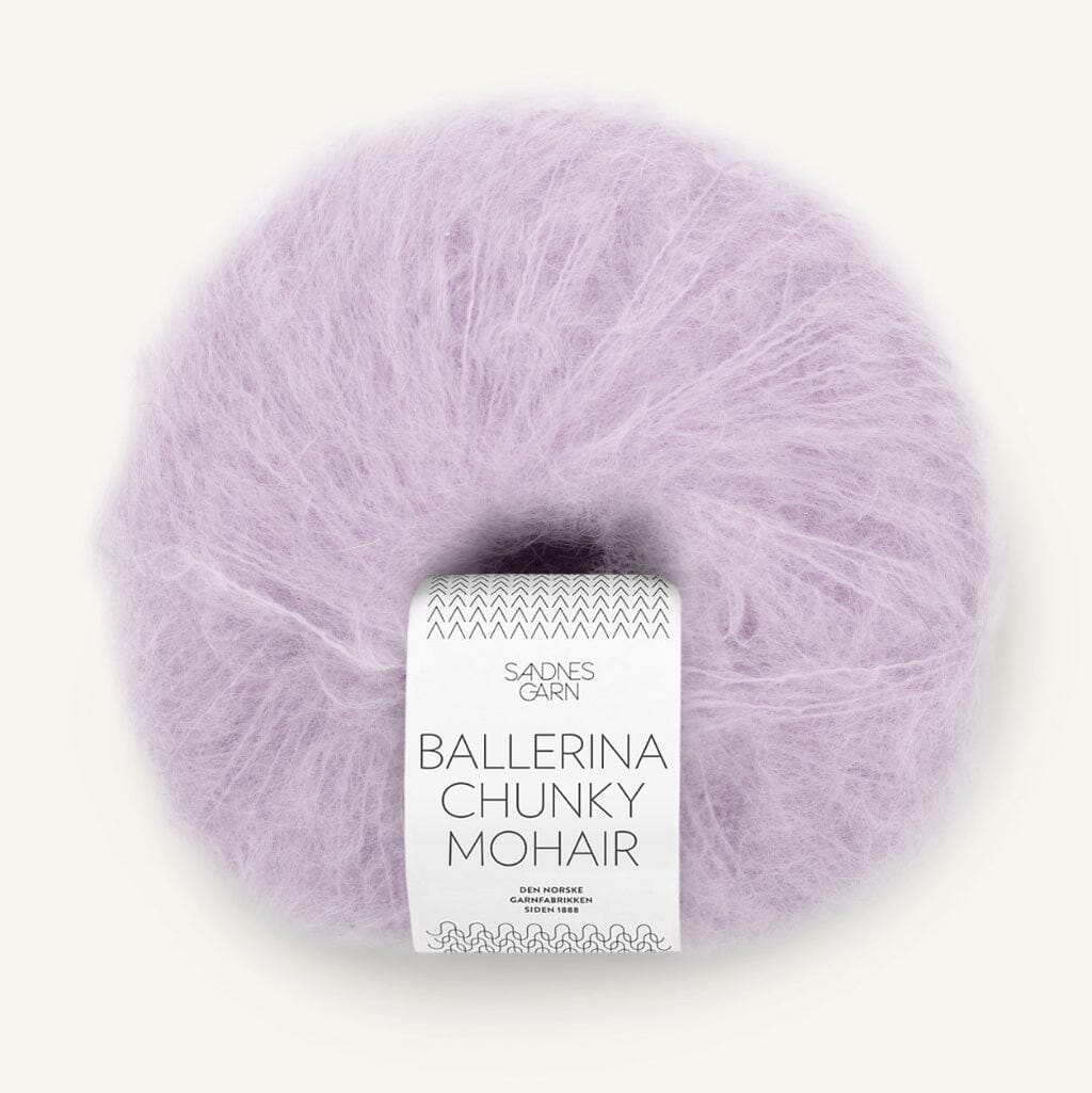 Ball of lavender yarn with a label on a white background