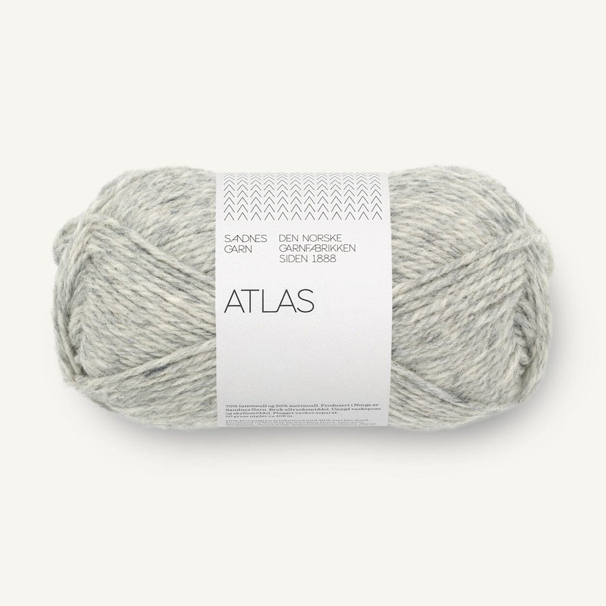 Ball of grey yarn with a label on a white background