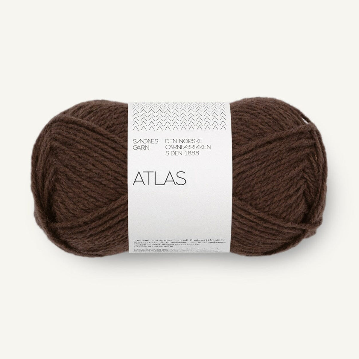 Brown skein of yarn with a white label on a white background