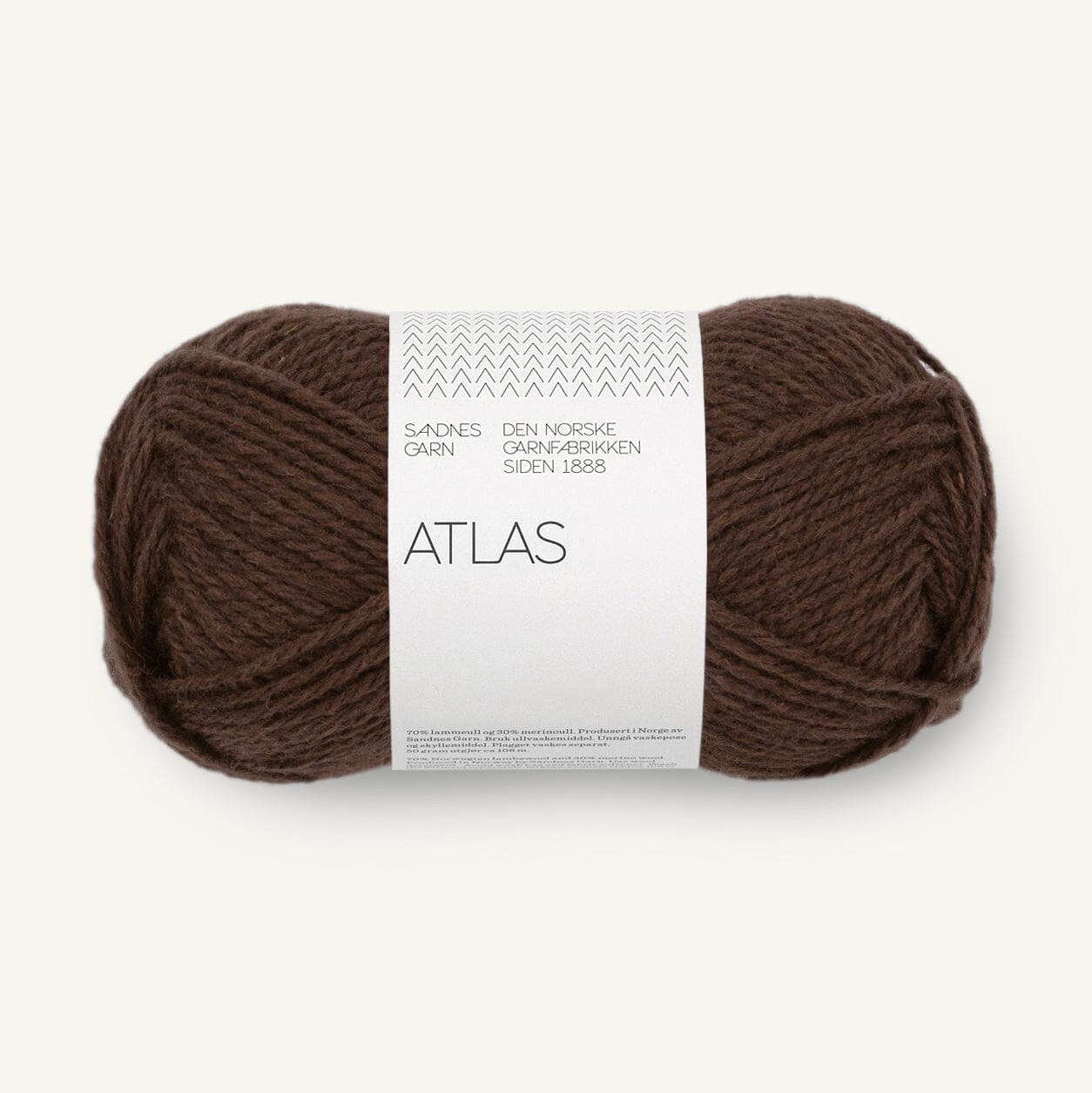 Brown skein of yarn with a white label on a white background