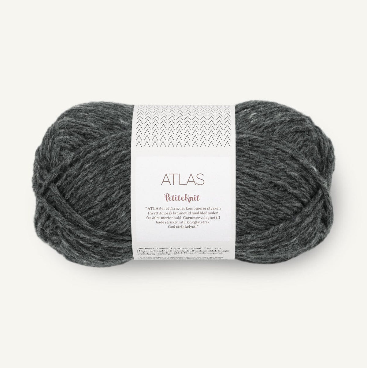 Grey ball of yarn with a label on a white background