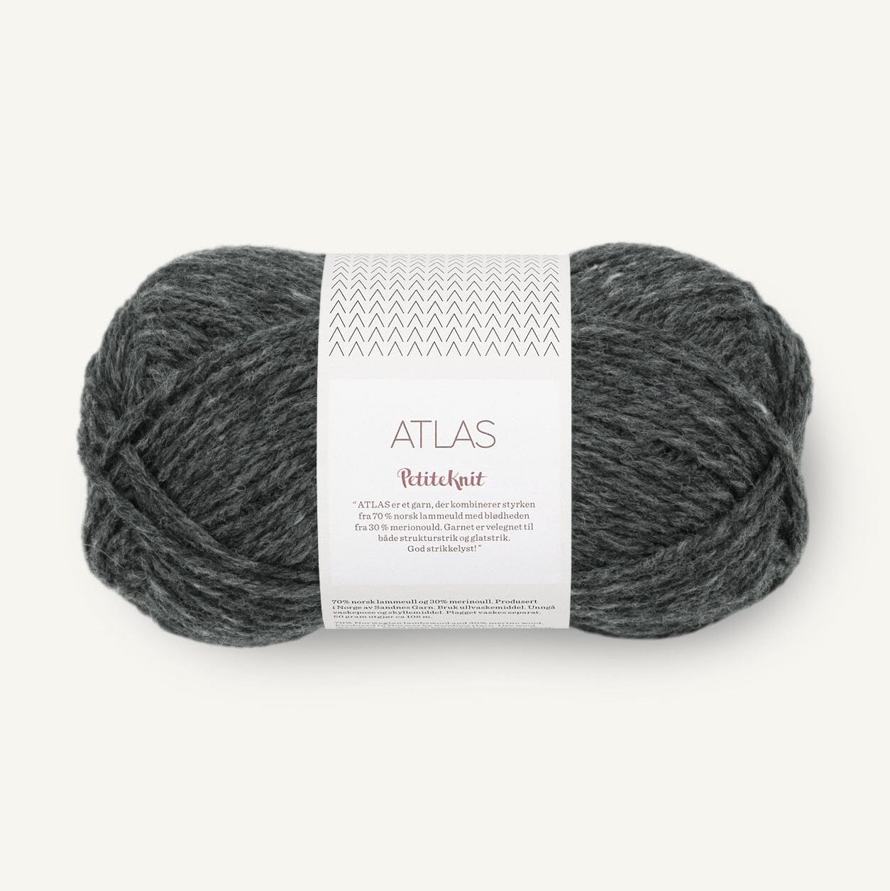 Grey ball of yarn with a label on a white background