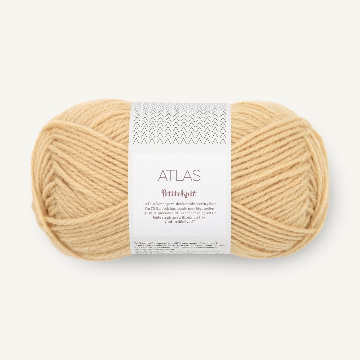 Ball of yellow yarn with a label on a white background