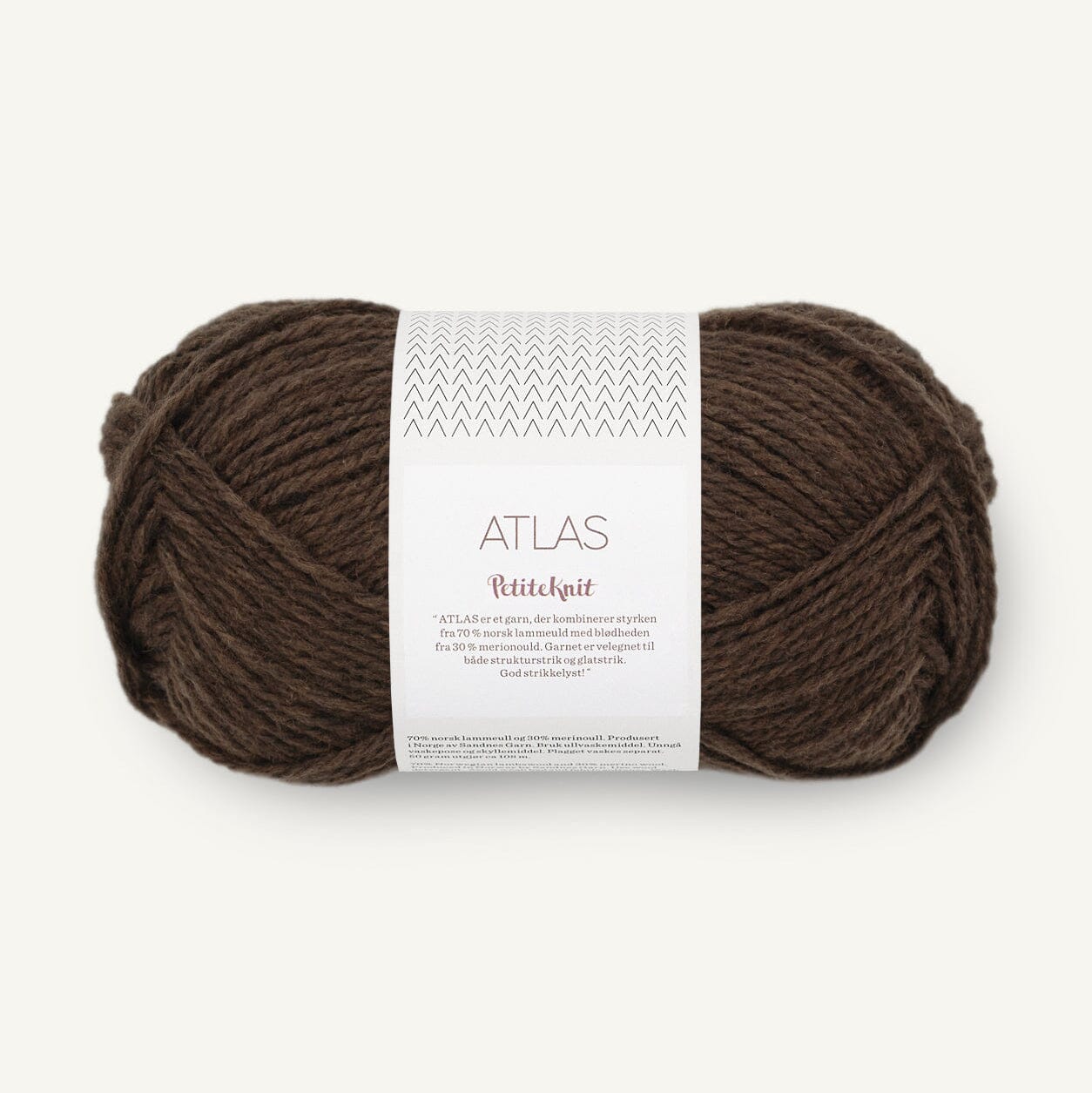 Brown yarn ball with a label on a white background