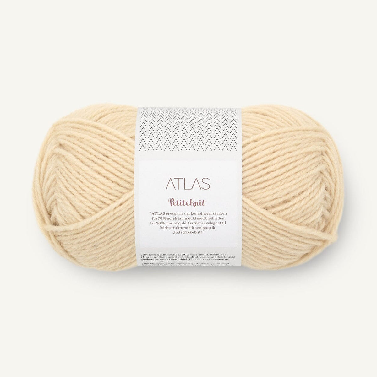Ball of cream-colored yarn with a label on a white background
