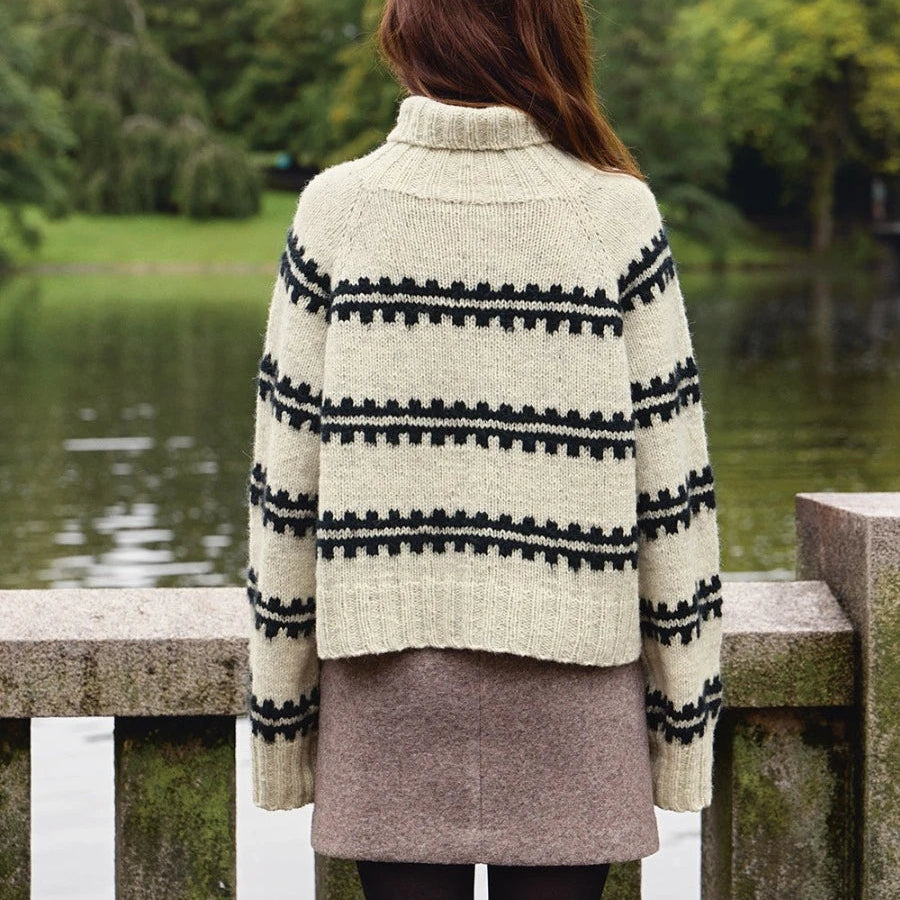 women wearing knitted sweater facing with back to the camera