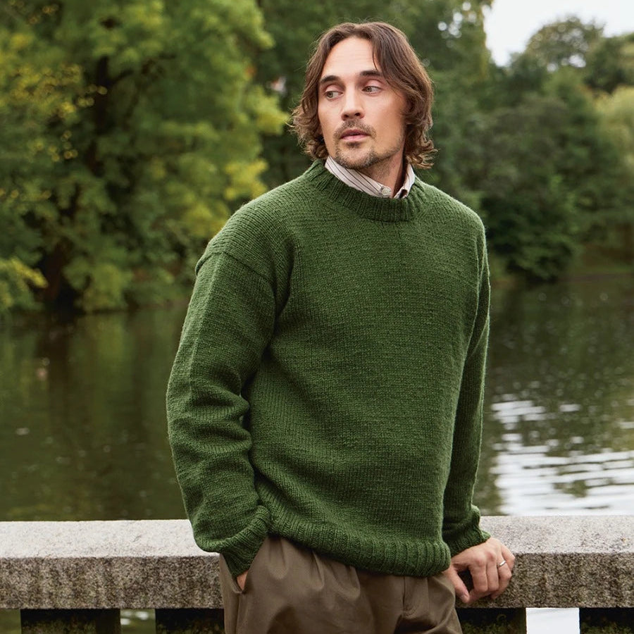 man wearing green knitted sweater