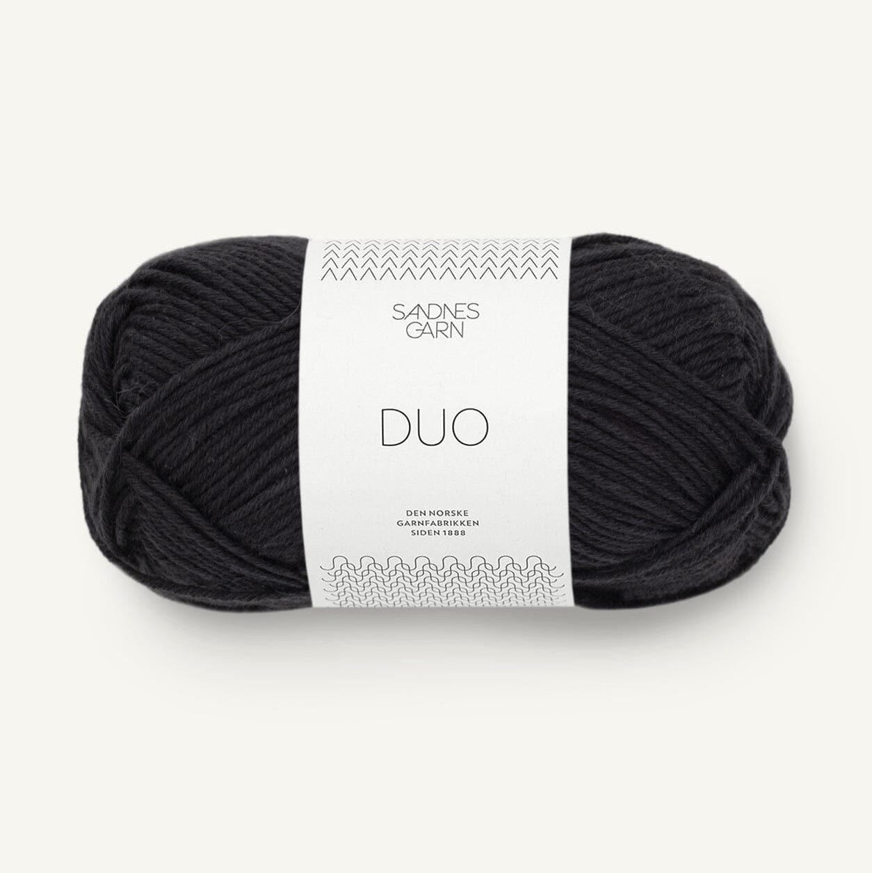 Black skein of yarn with a white label on a white background