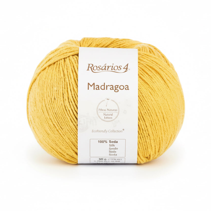 Yellow ball of silk yarn with a label on a white background