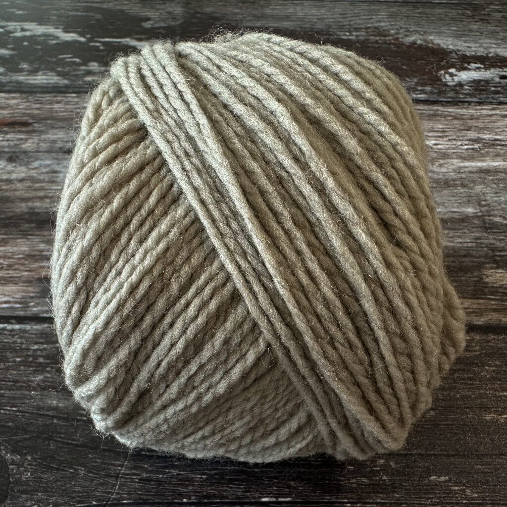 Ball of yarn on a wooden surface