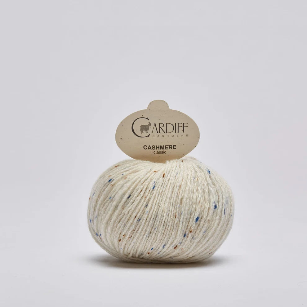Ball of yarn with a Cardiff label on a light gray background