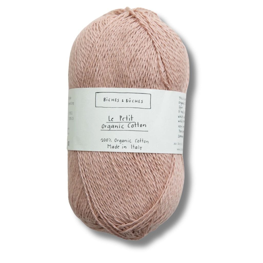 Light peach ball of cotton, biches&amp;buches on label with a white background