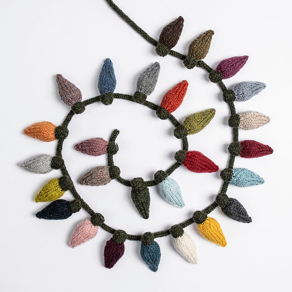 Knitted wreath with colourful bauble-shaped decorations on a white background