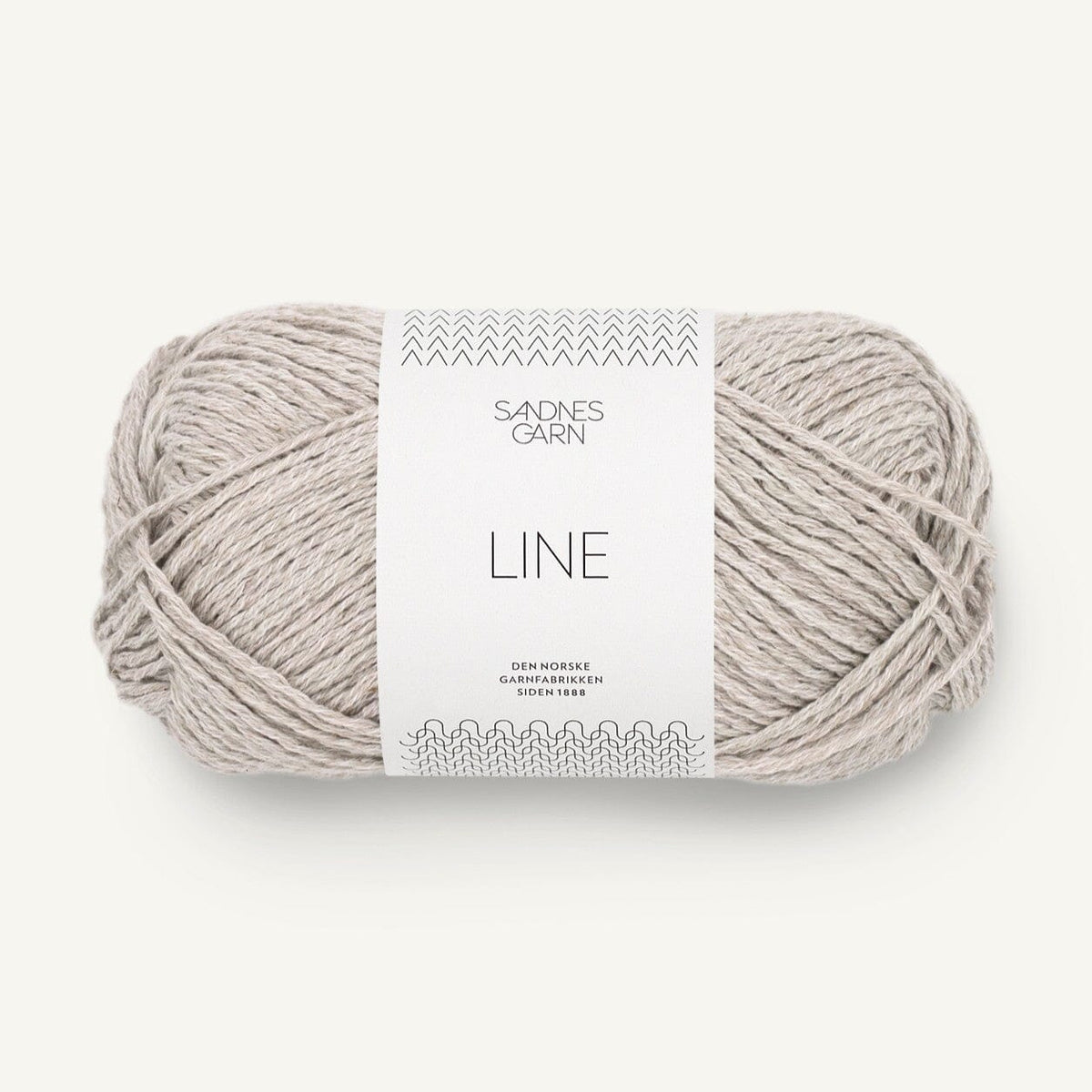 Ball of grey yarn with a label on a white background