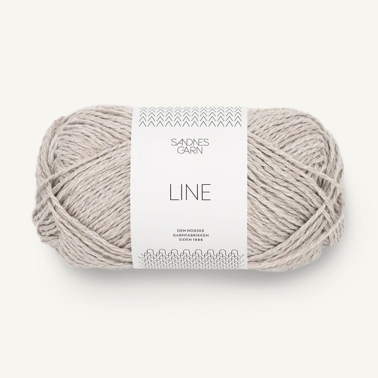 Ball of grey yarn with a label on a white background