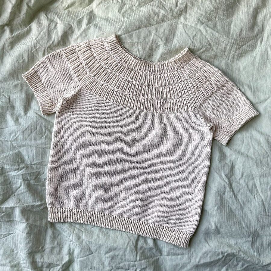Knitted t-shirt  on a textured fabric surface