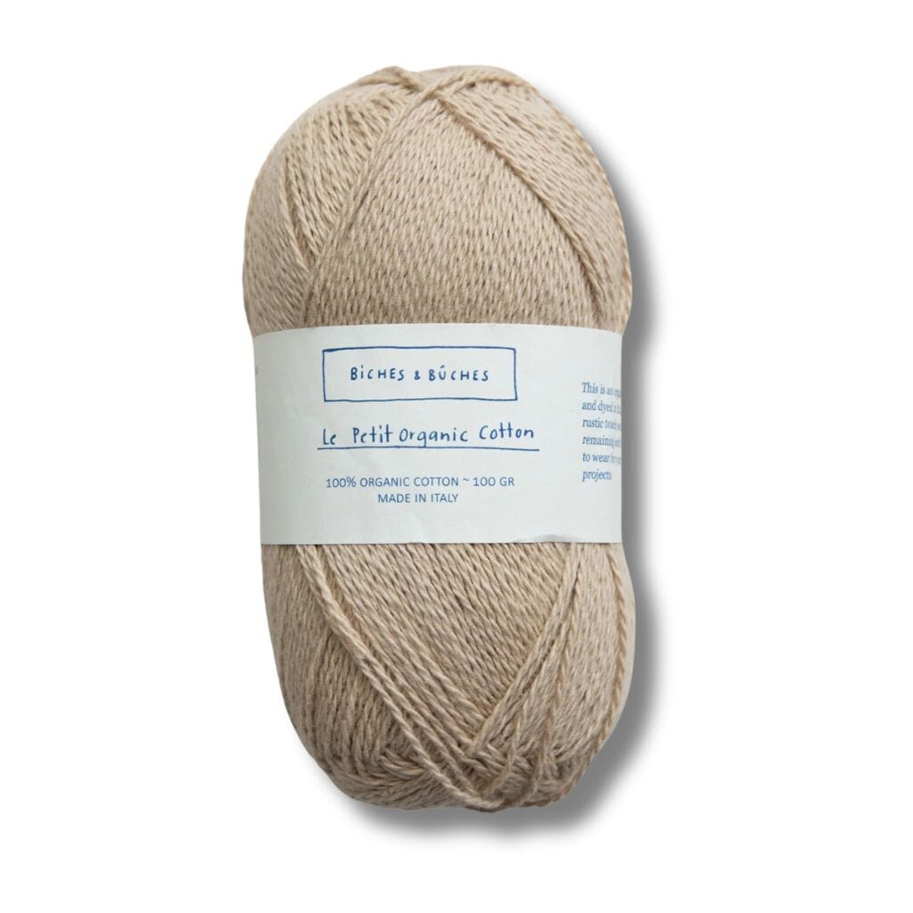 beige ball of cotton, biches&amp;buches on label with a white background