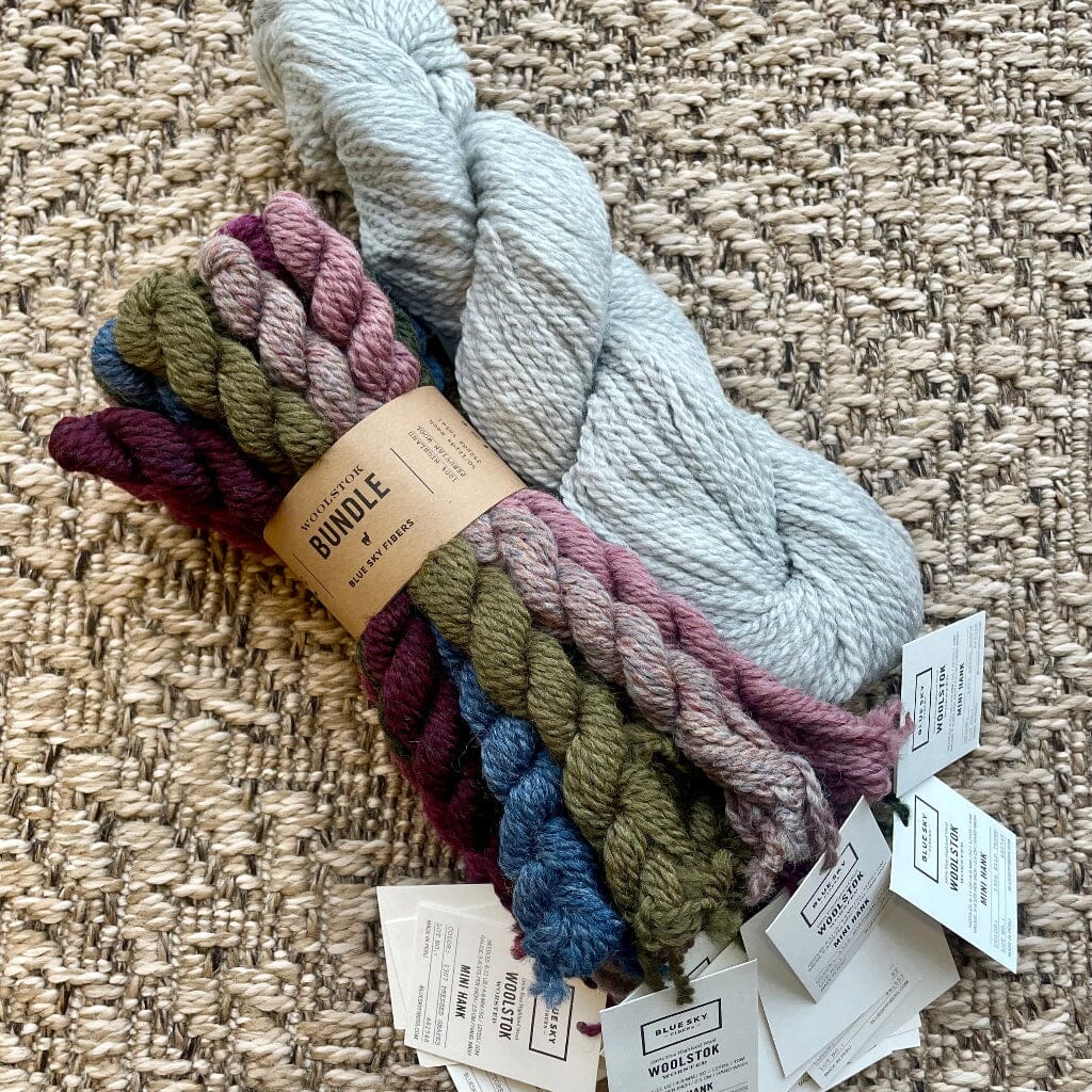 Bundle of yarn with tags on a textured surface
