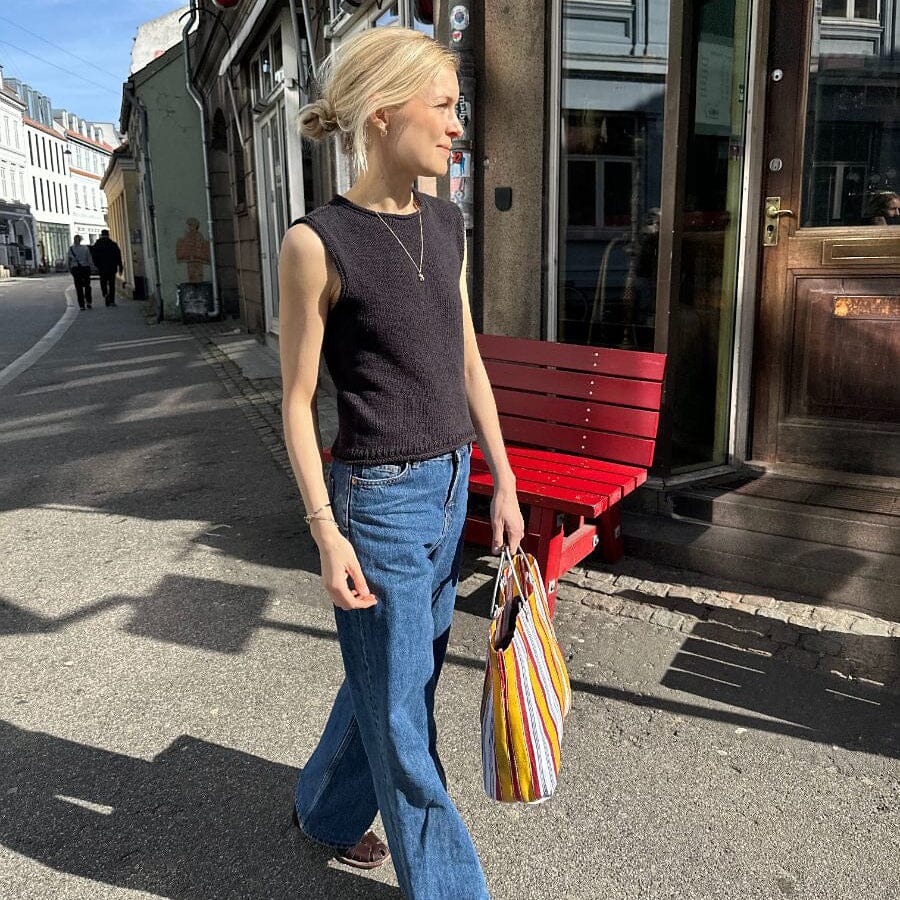 women wearing navy knitted vest.