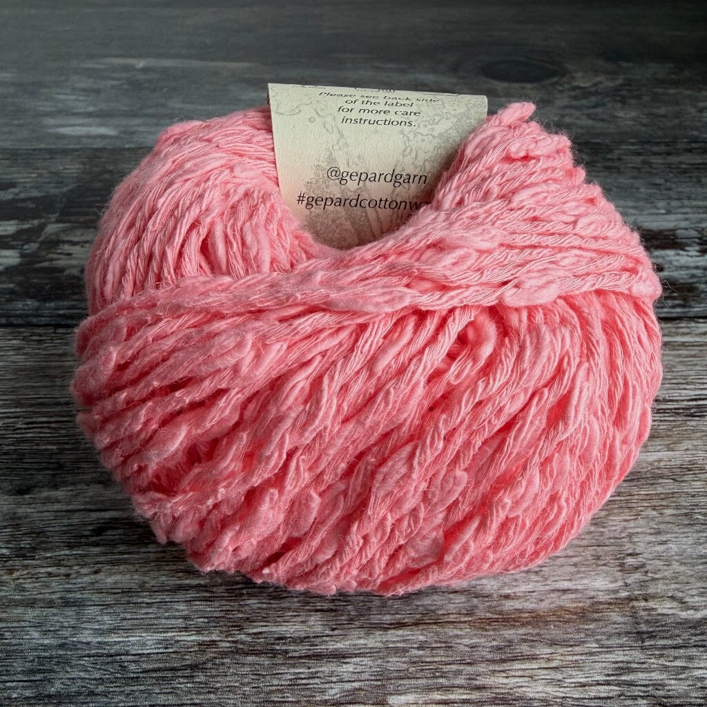pink boucle cotton knitting yarn in a ball