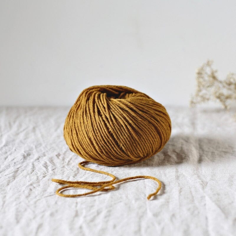 merino aran weight knitting yarn mustard yellow, de rerum natura cyrano