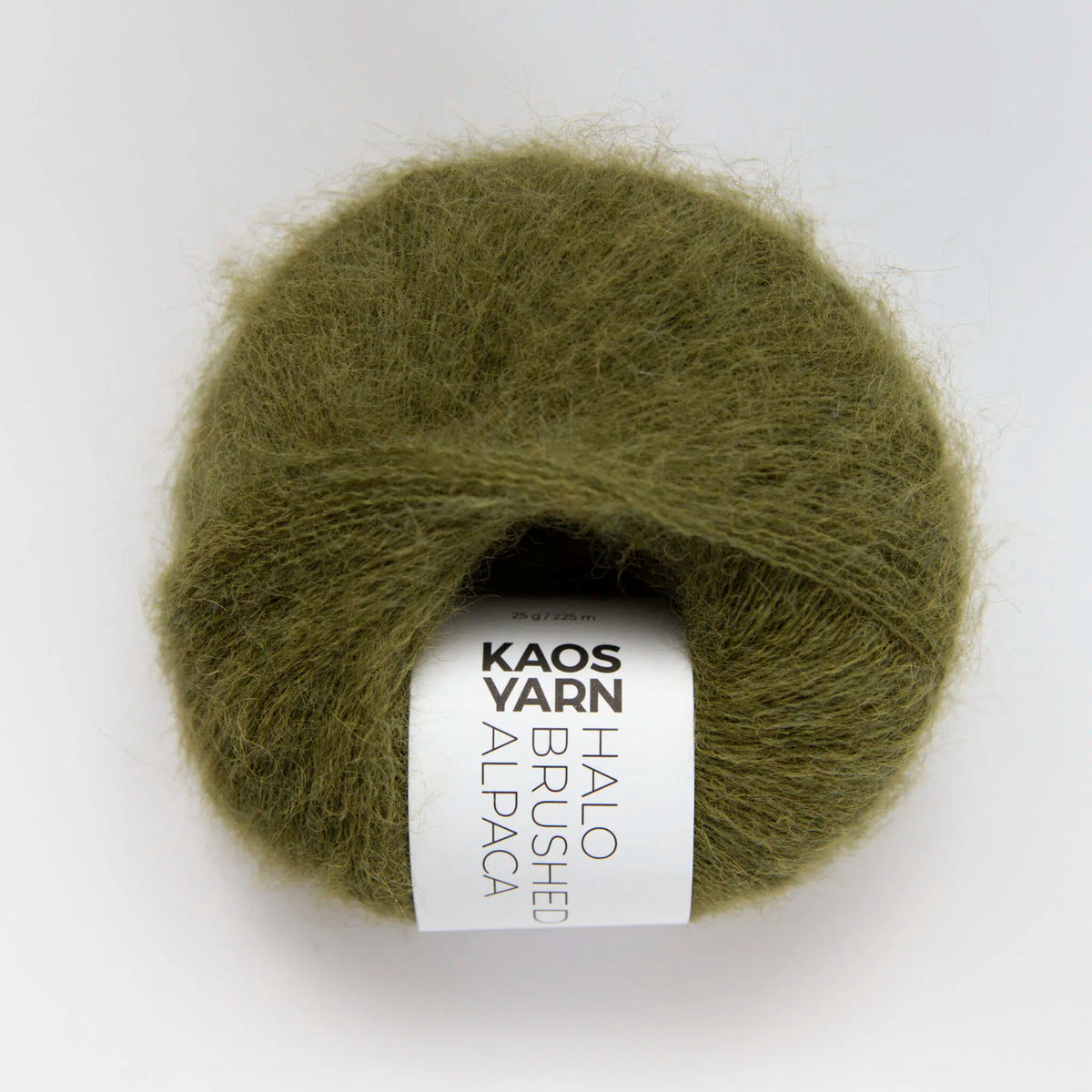 Ball of green yarn with a label on a white background