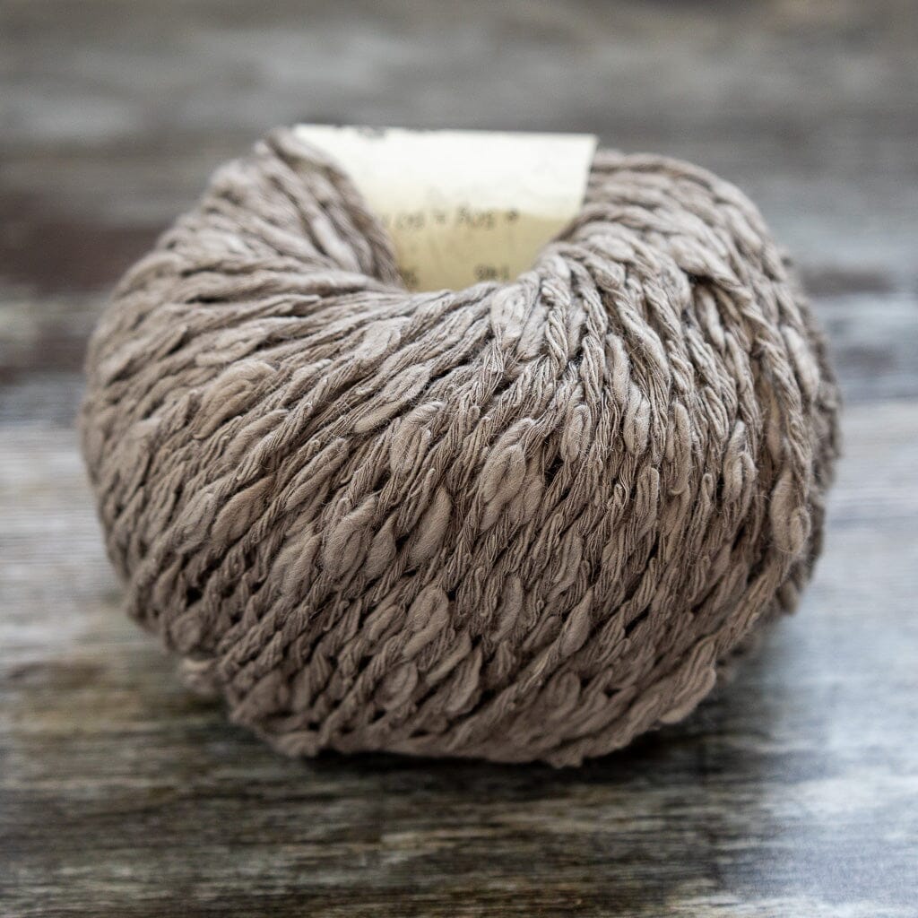 Ball of yarn on a wooden surface