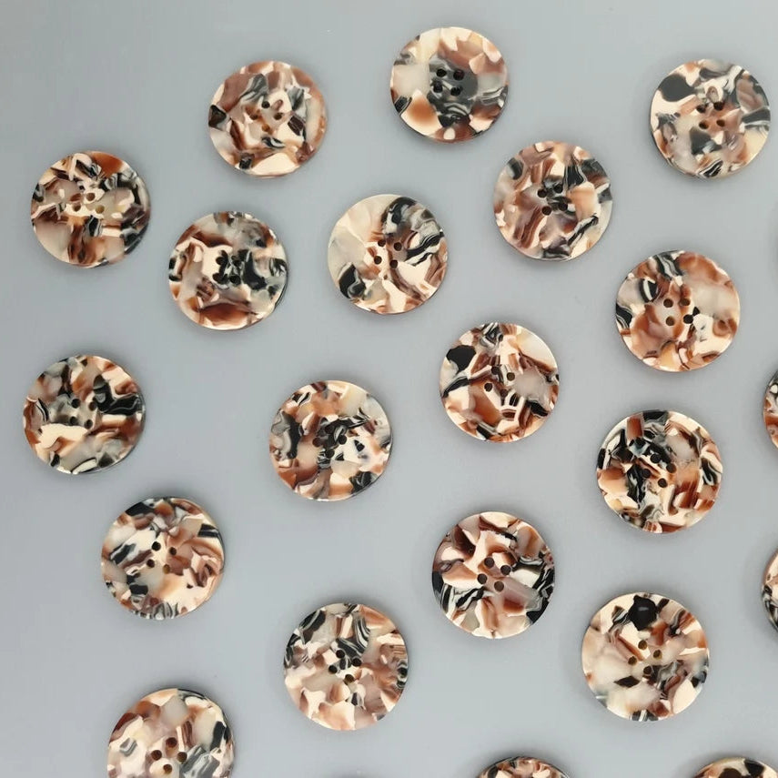 Patterned buttons arranged in a grid on a gray background