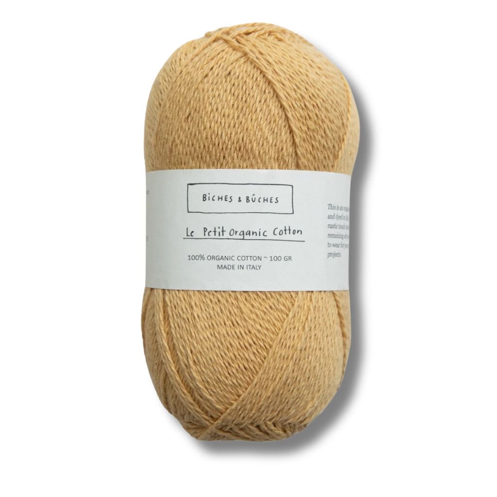 Light Yellow  ball of cotton, biches&buches on label with a white background