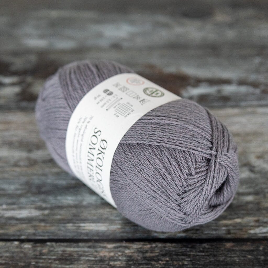 ball of grey yarn, a blend of merino wool and cotton.