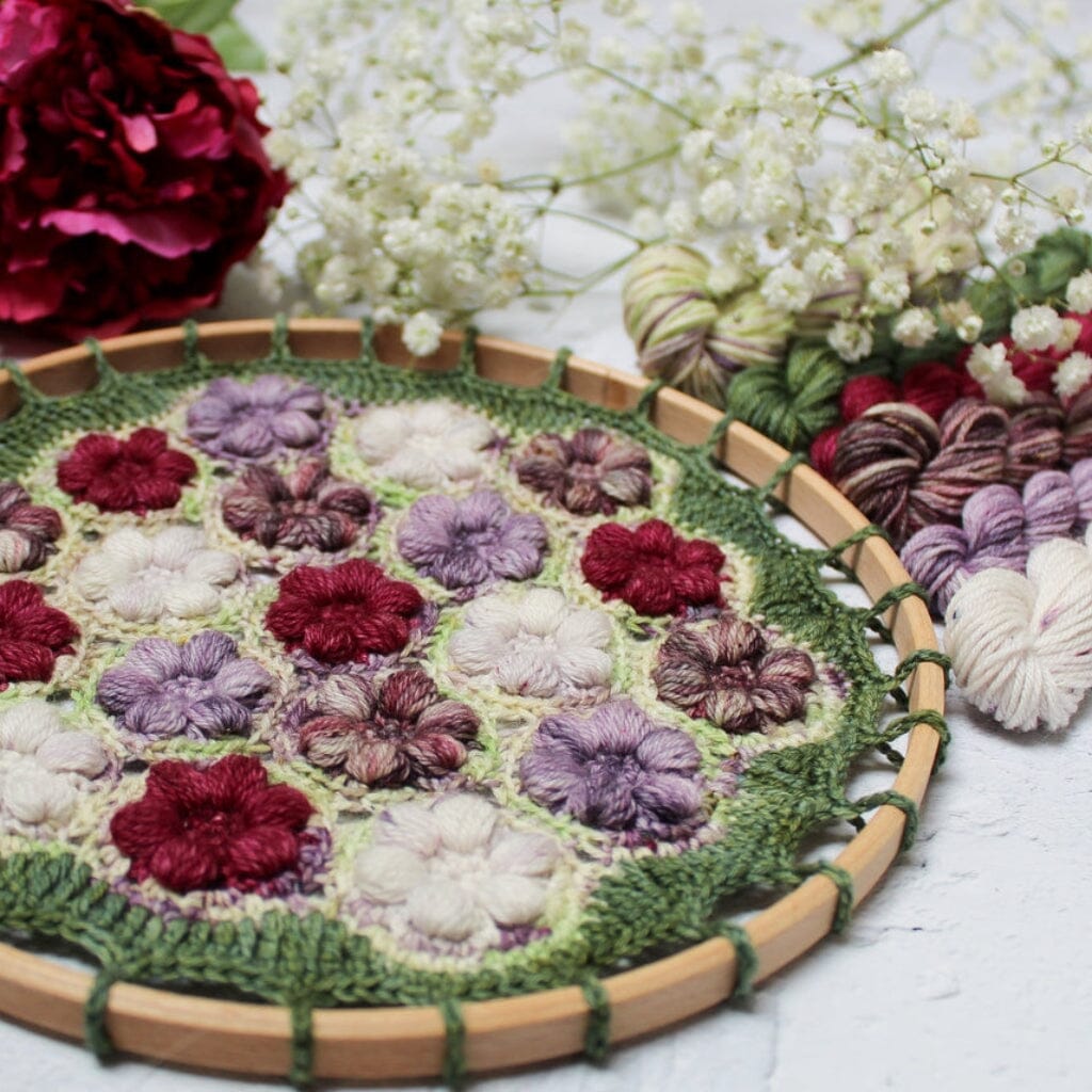 crochet mandala in pinks, purples and cream