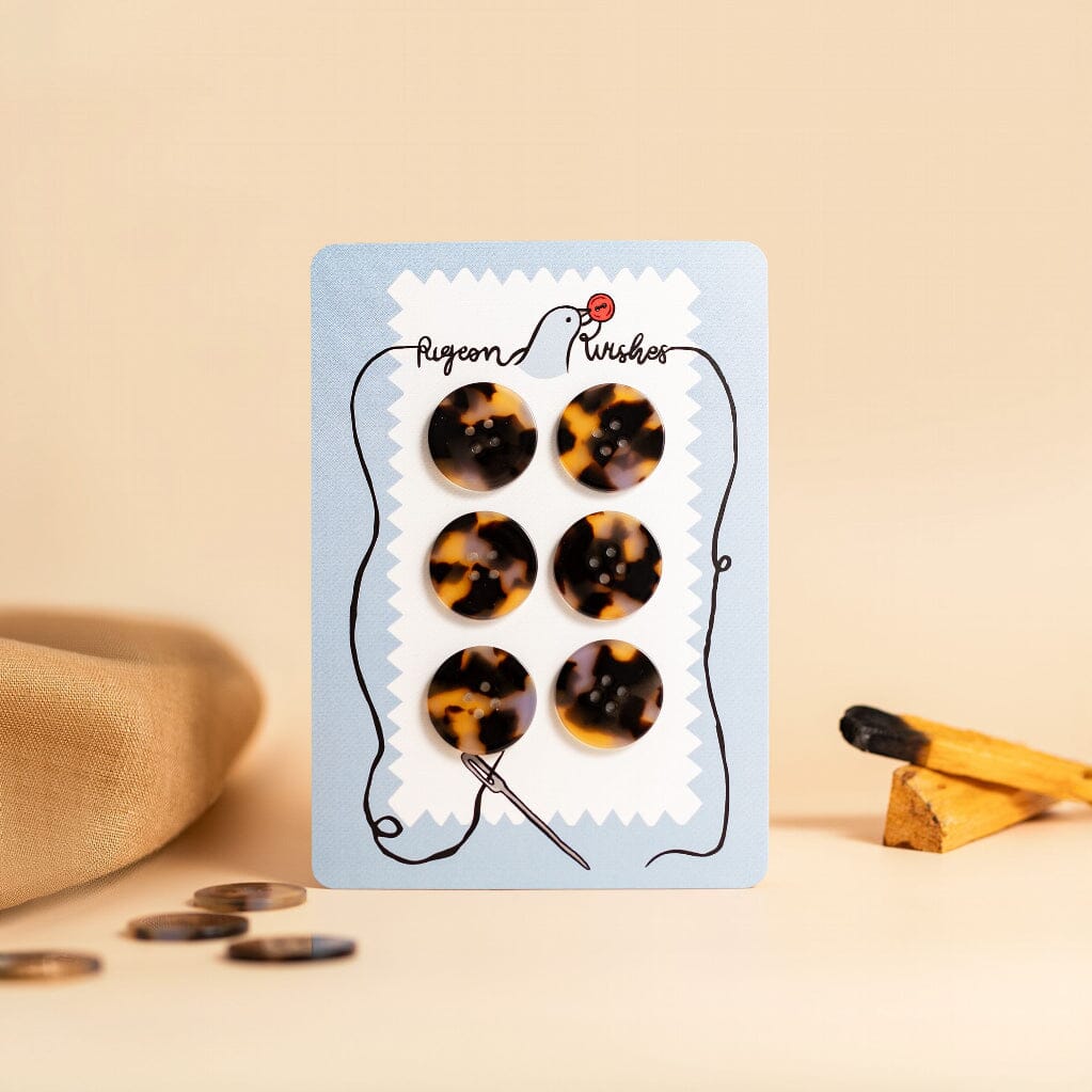 tortoise shell buttons on a card
