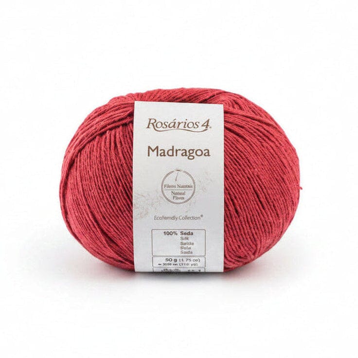 Red ball of yarn with a label on a white background