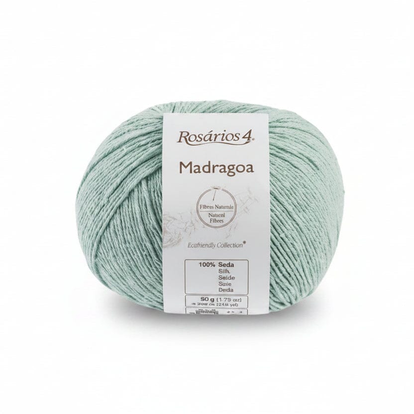 A ball of Rosários 4 Madragoa yarn in a soft mint green color, featuring a white paper label with product details, set against a plain white background.